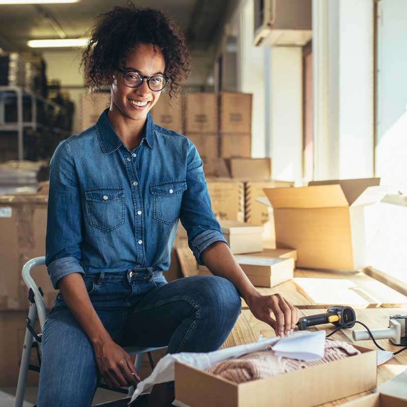 800x800 Wholesale Shipping & Packing Supplies - smiling woman packaging wholesale boxes