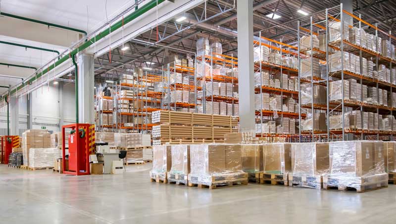 warehouse full of shrink wrapped boxes and pallets