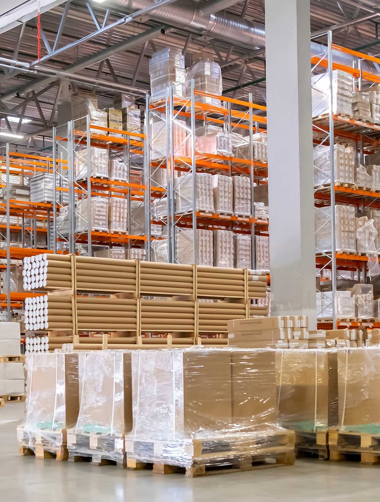 warehouse full of shrink wrapped boxes and pallets